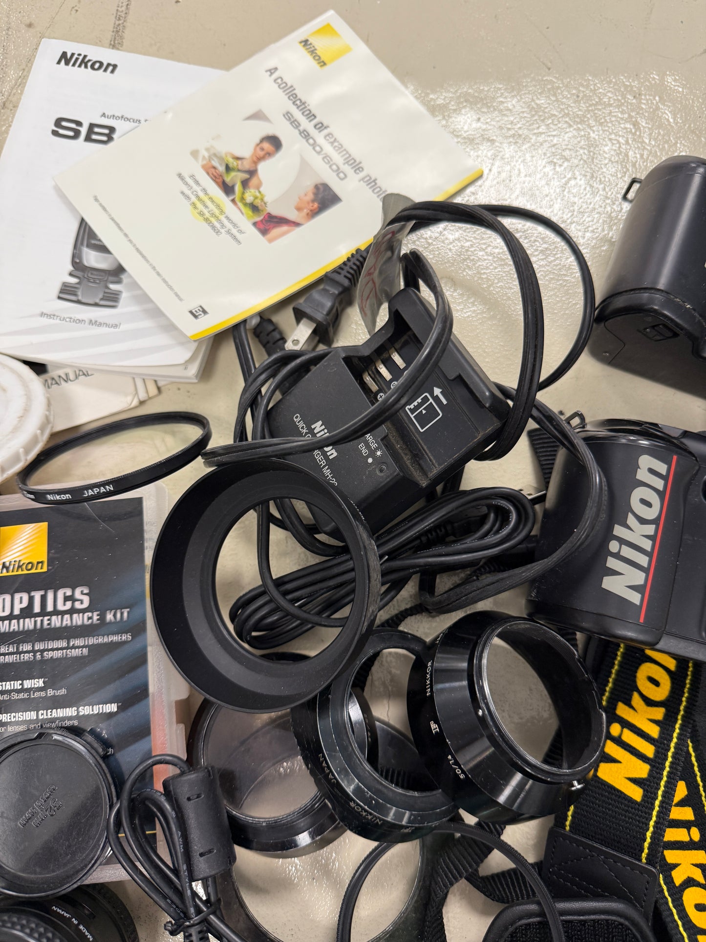 Nikon Film camera equipment lot lens, flash, caps, hood, strap