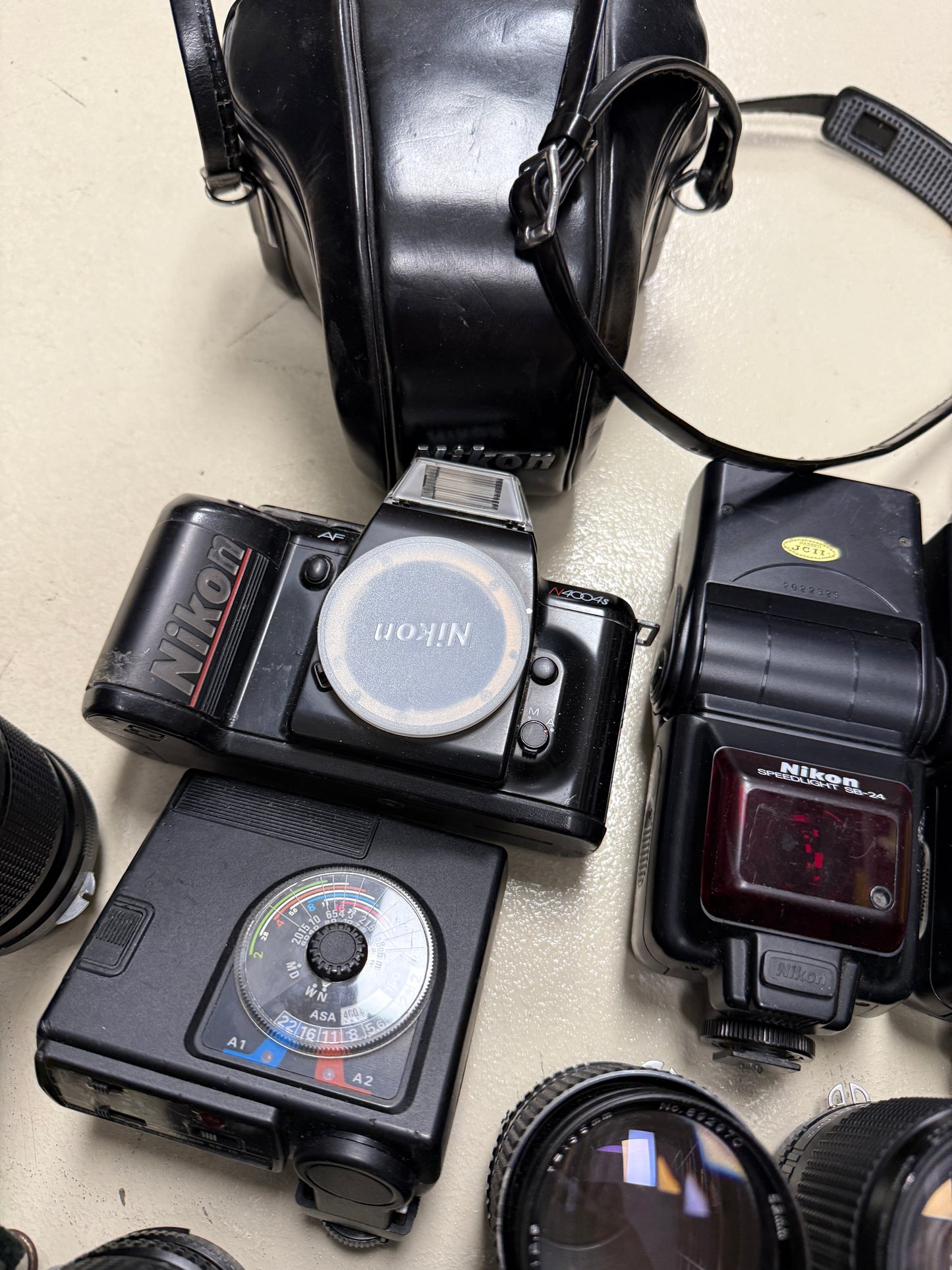 Nikon Film camera equipment lot lens, flash, case