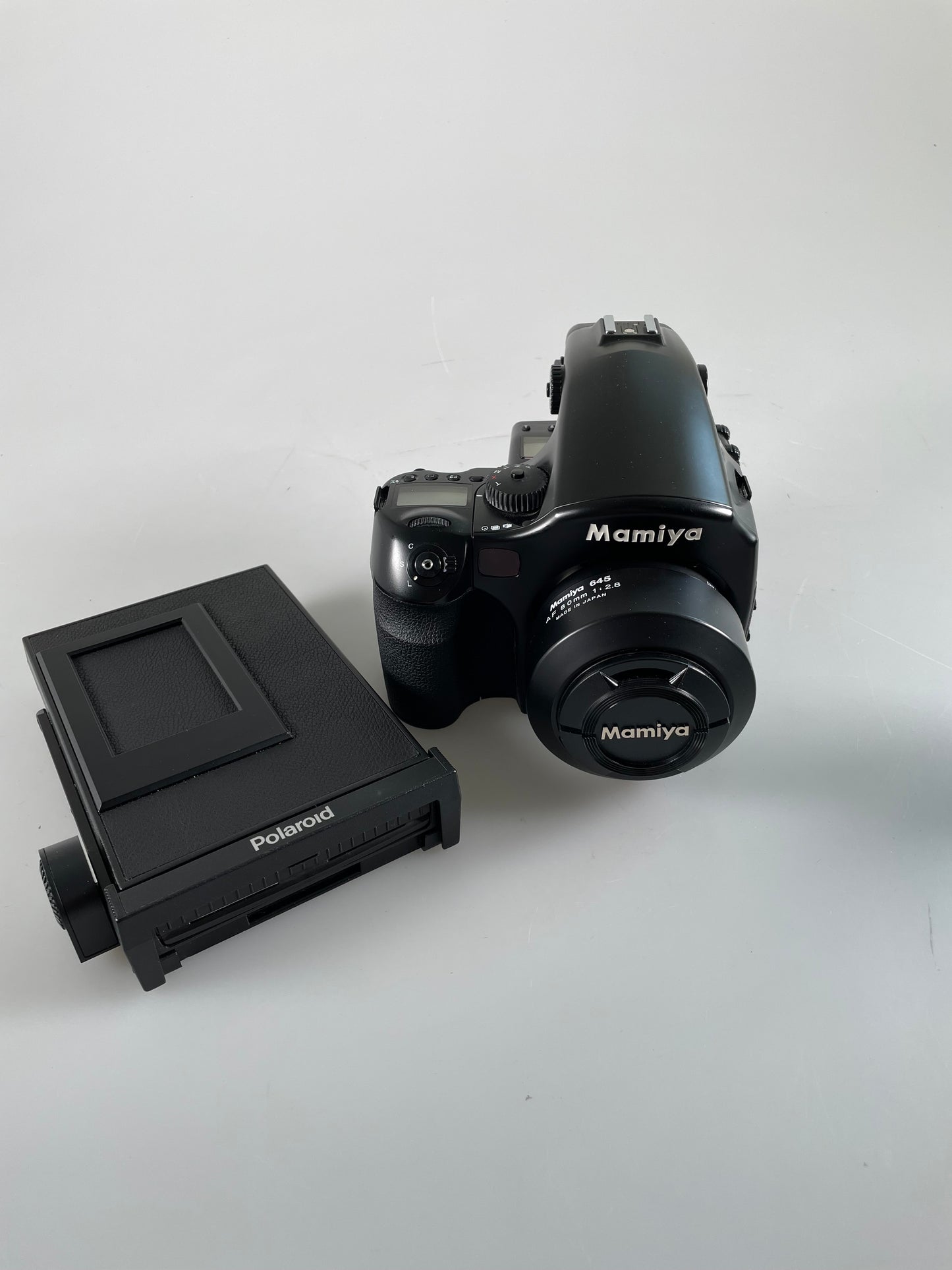 Mamiya 645 AFd medium format film camera with 80mm f2.8 lens, Polaroid back