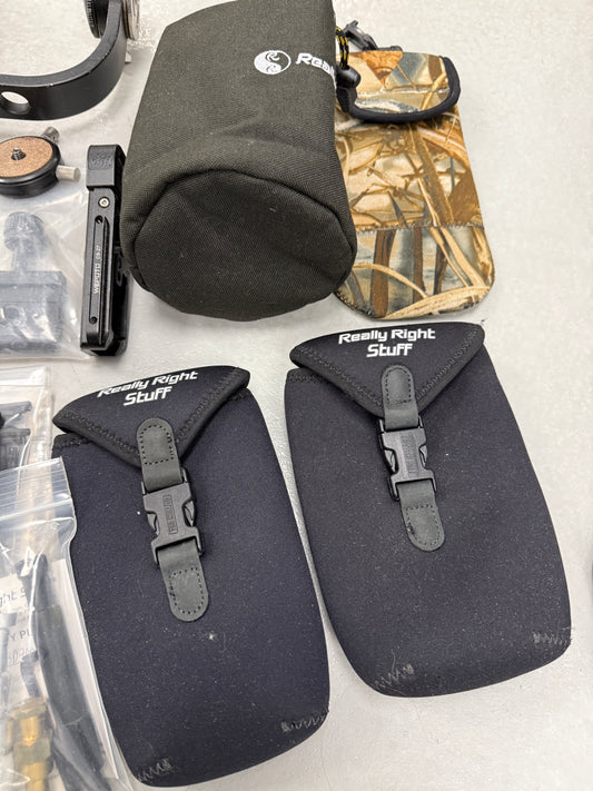 Lot of camera plates, tripod accessories and clamps really right stuff, Oben, Wefoto, etc