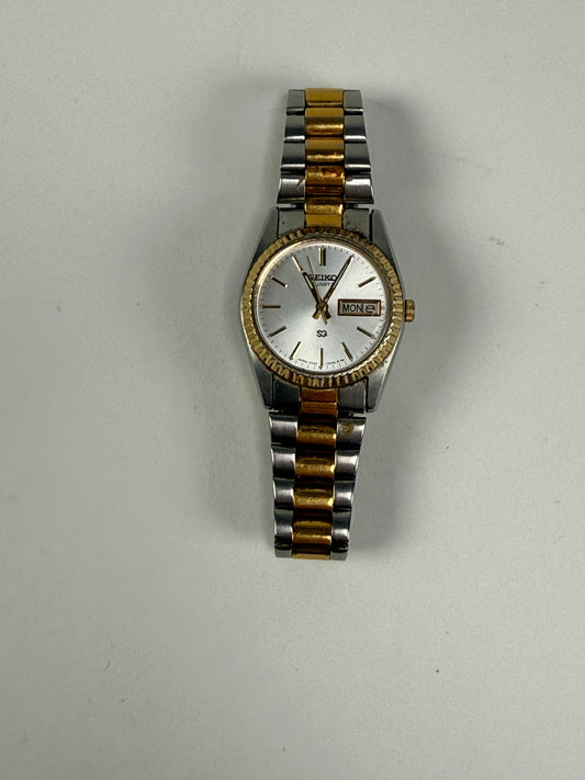 Seiko Quartz Womens Two-Tone Day/Date Silver Dial Dress Watch Model 2A23-0039