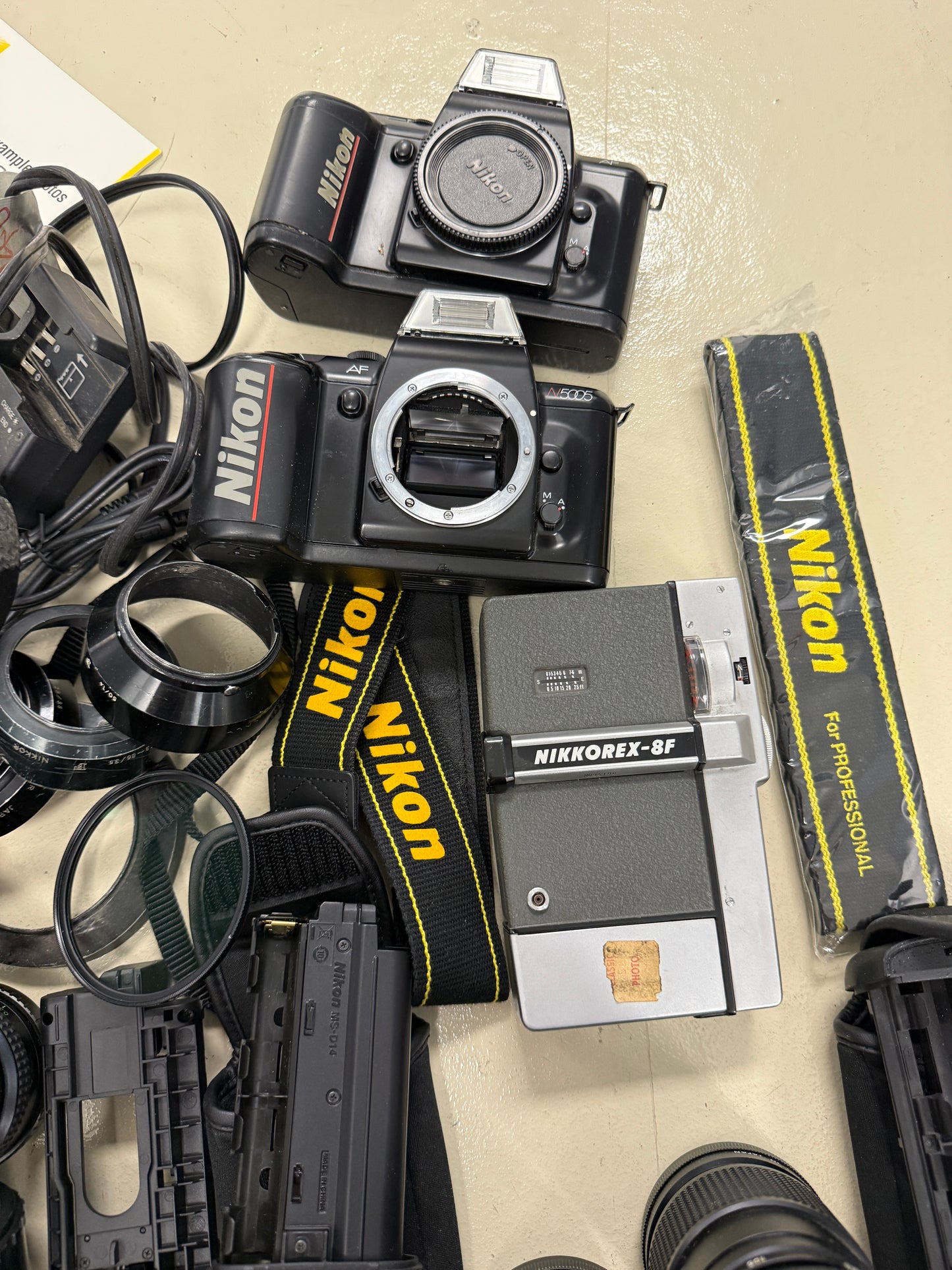 Nikon Film camera equipment lot lens, flash, caps, hood, strap