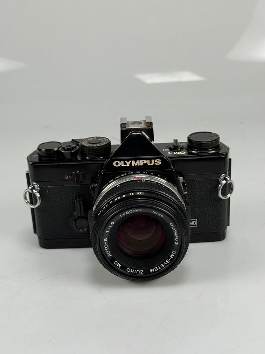 Olympus OM 1 35mm SLR Film Camera MC 50mm f/1.8 Lens Black