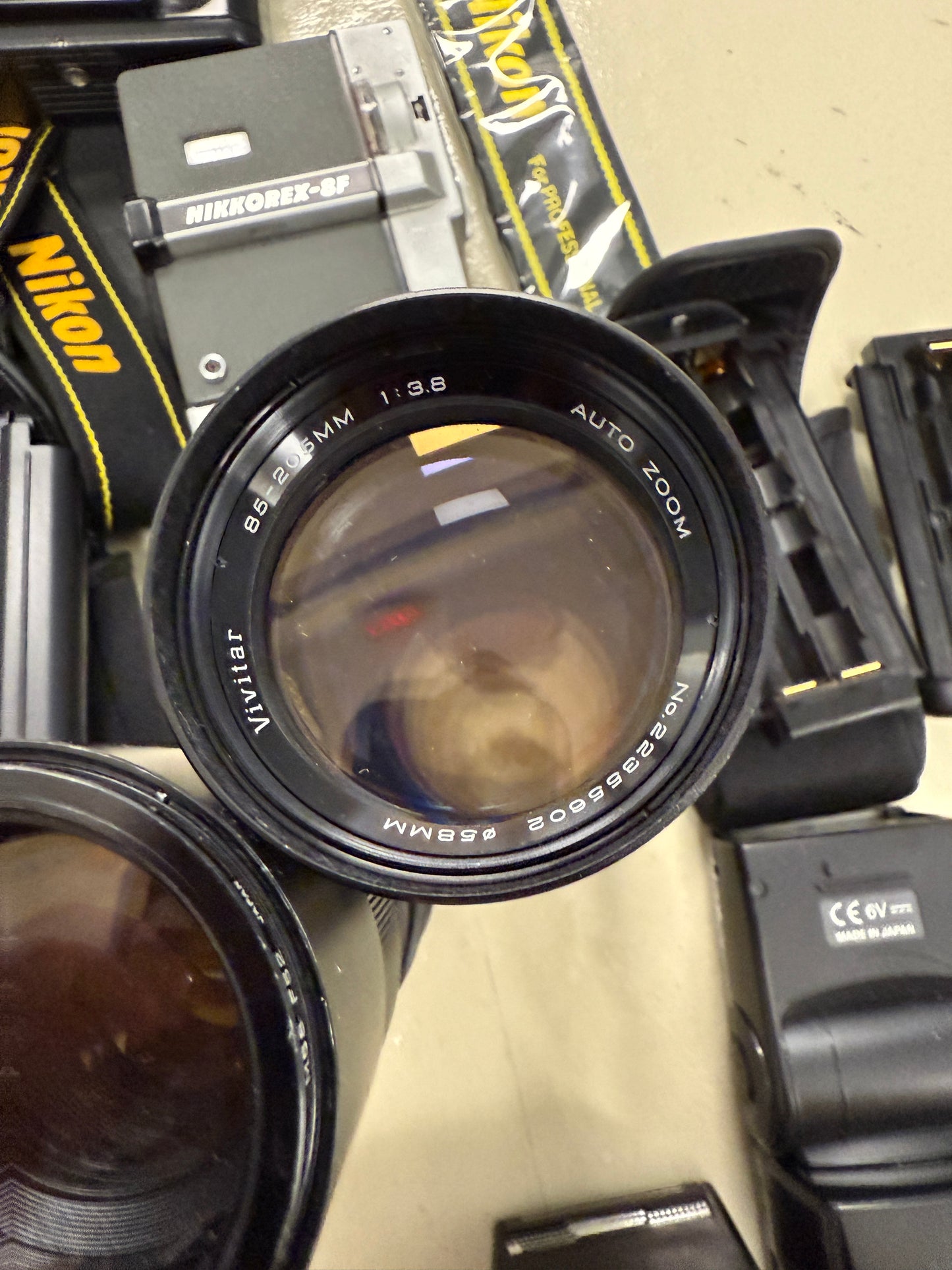 Nikon Film camera equipment lot lens, flash, caps, hood, strap