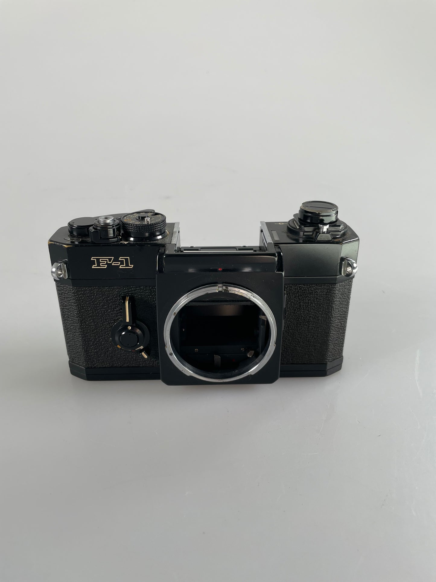 Canon F-1 Black 35mm SLR Film Camera with focus screen, base plate, battery door