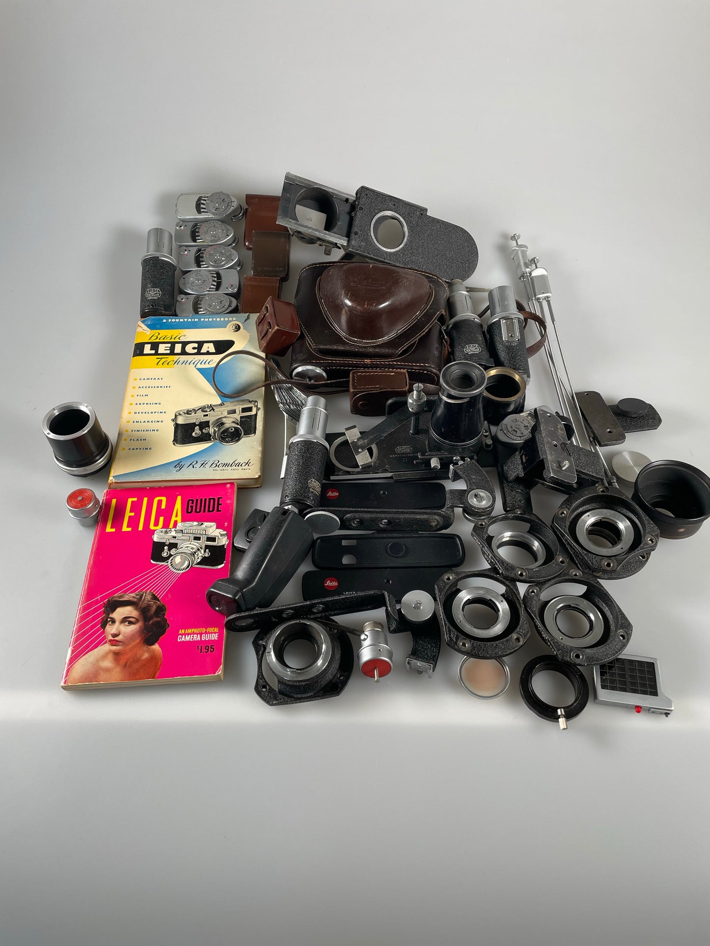 Lot of Leitz Leica Accessories - meter, flash, case, book, etc