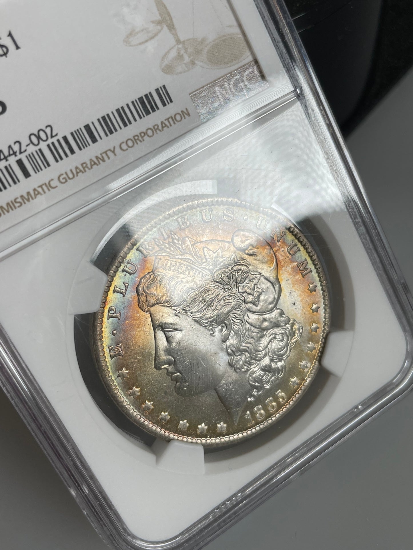 1885-O Morgan Dollar NGC MS65 Rainbow Toned