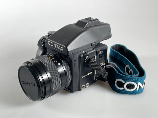 Contax 645 medium format film camera with 80mm f2 Zeiss Planar lens with strap/lugs